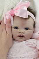 Baby Charlotte close up shot wearing large pink bow